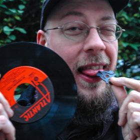 RRadio Clash 105: Musical Influences pt 1 Eat Records Man Woman! eclectic music mashup podcast cover shows Tim eating a vinyl 7" single